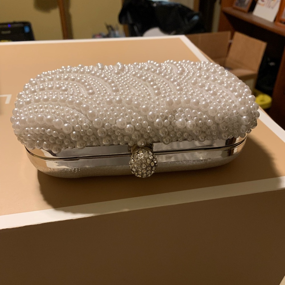 Silver and white clutch
